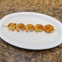 Shrimp Souvlaki Platter · Grilled fresh shrimp souvlaki served with  Greek salad, pita bread, tzatziki and choice of r...