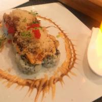 6. Volcano Roll · Crab meat, avocado, cucumber with soy bean seaweed, topped with roast scallop, crab meat, sp...