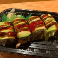 22. Dragon Roll · Eel, cucumber, topped with avocado, tobiko and eel sauce.