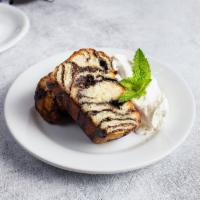 Chocolate Babka · (Two slices)
Layers of chocolate and buttery brioche served warm then topped with whipped c...
