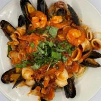 Seafood Marinara · Shrimp, mussels, scungilli, calamari and sauteed in a marinara sauce. Served over linguine a...