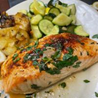 Broiled Norwegian Salmon · Fresh Norwegian salmon broiled in lemon, wine and butter. Served with a salad and choice of ...