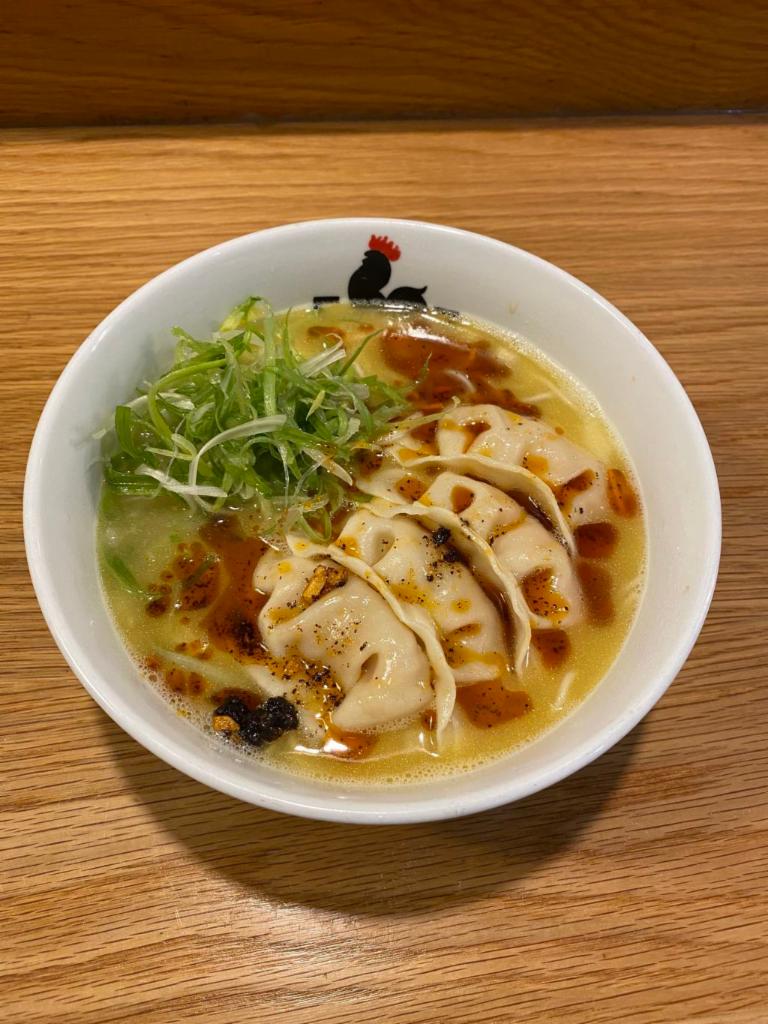 Spicy Gyoza Paitan · Our original straight noodle in our homemade Chicken Paitan & Vege Soup topped with spicy sesame oil, scallion, onion & Spicy Chicken Gyoza.