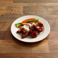 Bone-In Wings · Our classic, and most popular wings are baked twice until golden and crispy then tossed in y...