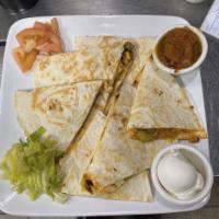 Quesadillas · Chicken breast, onion, peppers, cheddar cheese, sour cream and salsa.