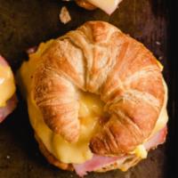 Croissant · Your favorite breakfast fillings inside a toasted buttered croissant.
