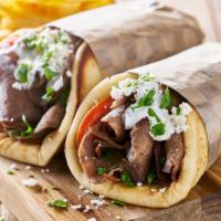Gyro Meal · Your choice of halal lamb or chicken, lettuce, tomatoes, grilled onions, & tzatziki sauce on...