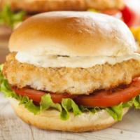 Catfish Sandwich · Fried catfish, lettuce, tomatoes, onions, pickles and tartar sauce on a toasted bun.