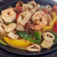 Sizzling Shrimp and Calamari Lunch · Grilled shrimp and calamari in olive oil, garlic, onion and bell pepper over skillet with go...