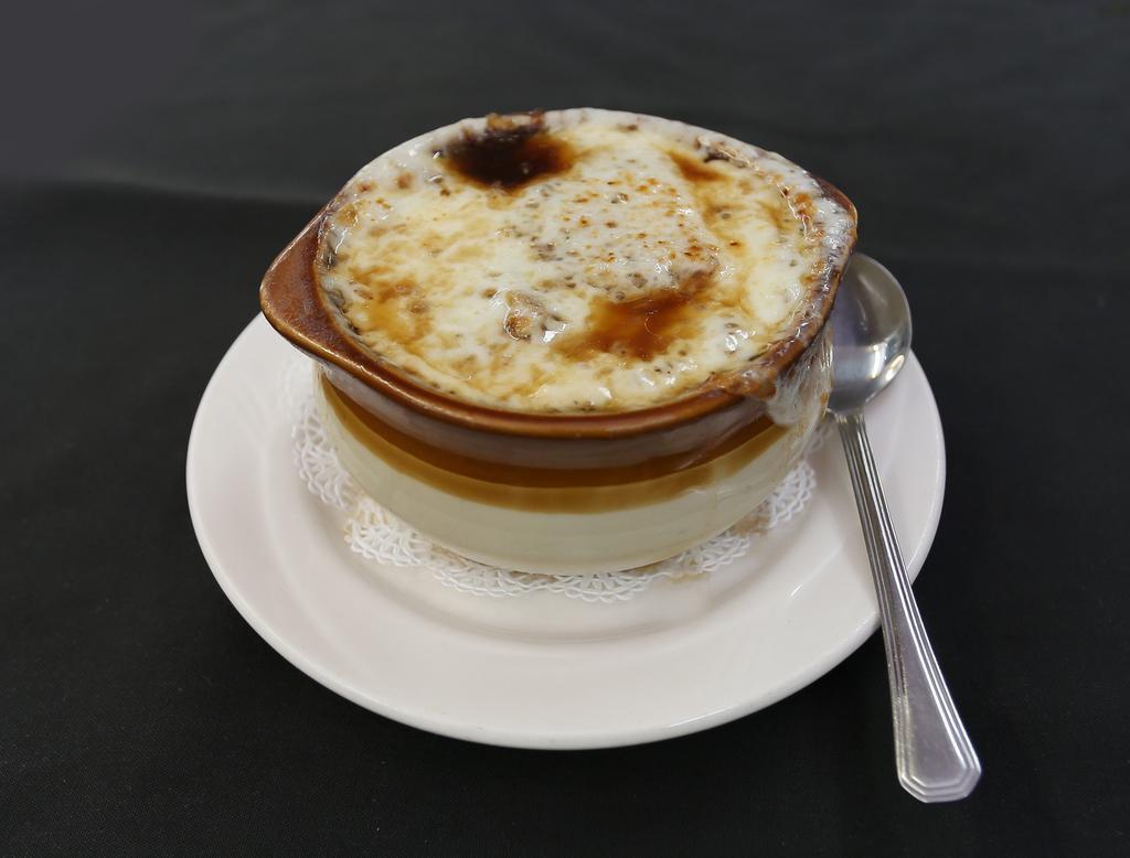 French Onion Soup Lunch · Caramelized onions, simmered in rich beefy broth, topped with imported Gruyere cheese.