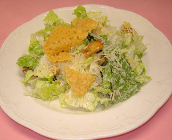 Caesar Salad Lunch · A crispy romaine salad tossed with classic style Caesar dressing, served with grated Parmesan.
