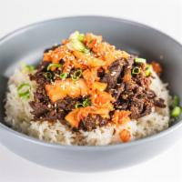 Bulgogi Bowl · Caramelized beef on steamed rice, with house made kimchi, sesame seeds, cucumber, carrots an...