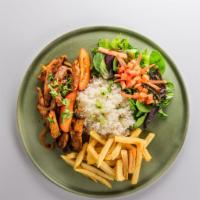 Pollo Saltado · Peruvian stir-fry of chicken, tomatoes, onions, cilantro, served over french fries with rice...