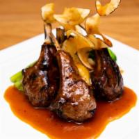 Asia Nine Lamb Chop · Tender lamb chop rubbed with house spices. Served with mango-soy coulis and wasabi mashed po...