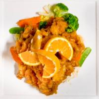 Orange Chicken · Lightly battered tender chicken sauteed in sweet orange chili sauce and served with jasmine ...