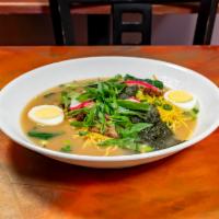 Ramen Noodle Soup · Ramen noodles, bamboo, spinach, roasted pork, and fish cake in a soy-based broth.