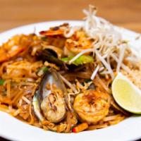 Pad Woon Sen · Cellophane noodles sautéed with egg, mushrooms, tomatoes, onions, and scallions in light gar...