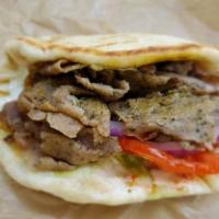 #6. Gyro Combo · Tender beef slices with tzatsiki sauce, lettuce and tomato on toasted pita bread. Served wit...