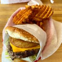 #8. Saturn Burger Combo · 1/4 beef patty with lettuce, pickle, tomato, BBQ sauce and two deep fried onion rings on a s...
