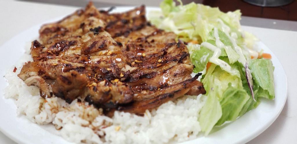 Beef Teriyaki · Grilled marinated beef on a bed of steamed white rice and drizzled in homemade teriyaki service. Served with a small side salad with our signature Poppyseed dressing.