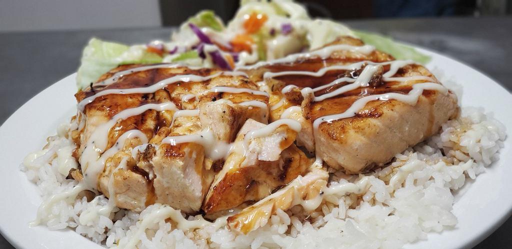 Salmon Teriyaki · Tender grilled salmon on a bed of steamed white rice and drizzled in homemade teriyaki service. Served with a small side salad with our signature Poppyseed dressing.