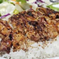 Chicken Teriyaki Combo · Grilled teriyaki chicken on a bed of steamed white rice and drizzled in homemade teriyaki sa...