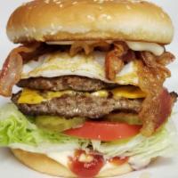 Breakfast Burger · 1/4 lb. beef patty with bacon, cheese, tomato, pickle, lettuce, a fried egg, ketchup and mayo.
