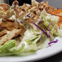 Teriyaki Chicken Salad · Diced teriyaki chicken on a bed of fresh lettuce, red cabbage and carrot. Drizzled in our ho...