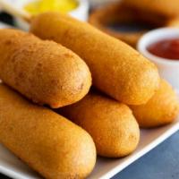Corn Dog · A classic beer battered sausage on a stick. You're never too old for one of these!