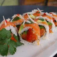 Salmon Lover Sushi Roll · Spicy salmon, cucumber, jalapeno and cilantro topped with salmon, avocado and jumbo onion in...