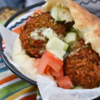 Classic Forever Sandwich · Classic falafel, hummus, Israeli salad and tahini. Vegan.