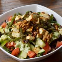 Halloumi Salad · Mixed greens, spinach, tomato, cucumber, topped with sauteed onions, green pepper, walnut an...