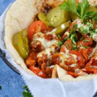Vegan Shawarma Platter · Soybean shawarma, sauteed cherry tomato and onions, harissa, amba and tahini served on laffa...
