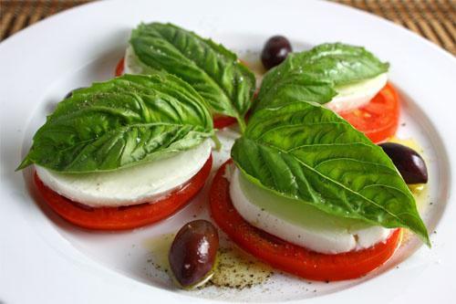 Caprese Salad · Sliced tomato, fresh mozzarella, Kalamatta olives, artichoke, basil and balsamic vinegar.