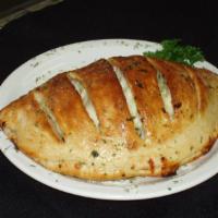 Empire State Calzone · Melted mozzarella, ricotta cheese and ham. 