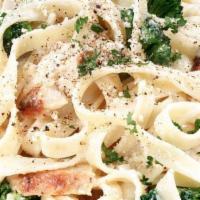 Fettuccine Alfredo with Chicken · Fettuccine in creamy Alfredo sauce with cheese and chicken.