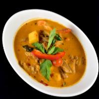 Duck Curry* · Roasted duck in red curry paste pineapple, tomato, bell pepper and basil. Medium spicy.