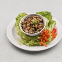 Thai Lettuce Wraps · Tender chicken, fresh cut jicama and button mushrooms wok seared in our signature sauce. Car...