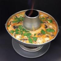 12. Tom Kha Chicken Soup · Served with spicy coconut milk soup, mushroom, onion, lemon grass, galanka root, kaffir leav...
