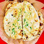 Onion Kulcha · Naan bread baked in tandoor oven with onion and spices.