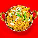 Vegetable Biryani · Basmati rice cooked with vegetables, nuts, raisins, and spices.