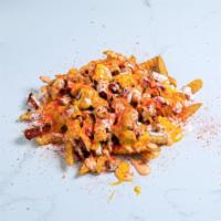 Loaded Fries · Seasoned French fries with two large diced chicken tenders, topped with cheese, spicy aioli ...