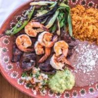 Carne Asada and Shrimp( rice and beans ) · Marinated and grilled beef.