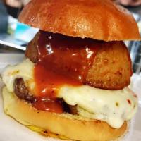 Spicy South West Burger · Pepper jack cheese, pickled jalapenos, onion ring, peach habanero BBQ sauce. Served with fri...
