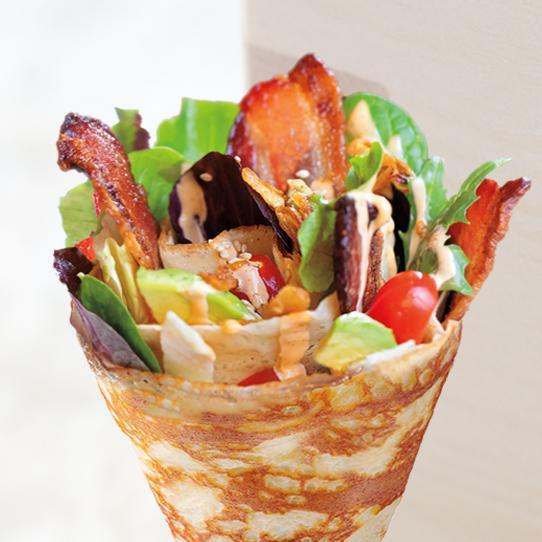 6. Eight Turn's Famous B.L.T Crepe · Thick-cut smoked applewood bacon, lettuce, mixed greens, cherry tomatoes, avocado, shallots, housemade chipotle aioli and balsamic dressing.