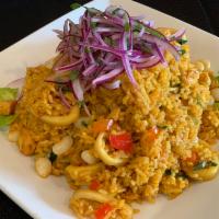 Arroz con Mariscos · Rice mixed with seafood and Peruvian spices.