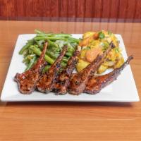 Lamb Chops · 5 grilled lamb chops. Served with 2 sides.

