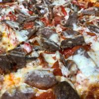 Speciale Pizza · Loaded with homemade sausage, pepperoni, homemade meatballs, mushrooms, caramelized onions, ...