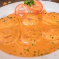 Seafood Ravioli · Cheese ravioli with scallops, shrimp and crabmeat in a pink sauce. 