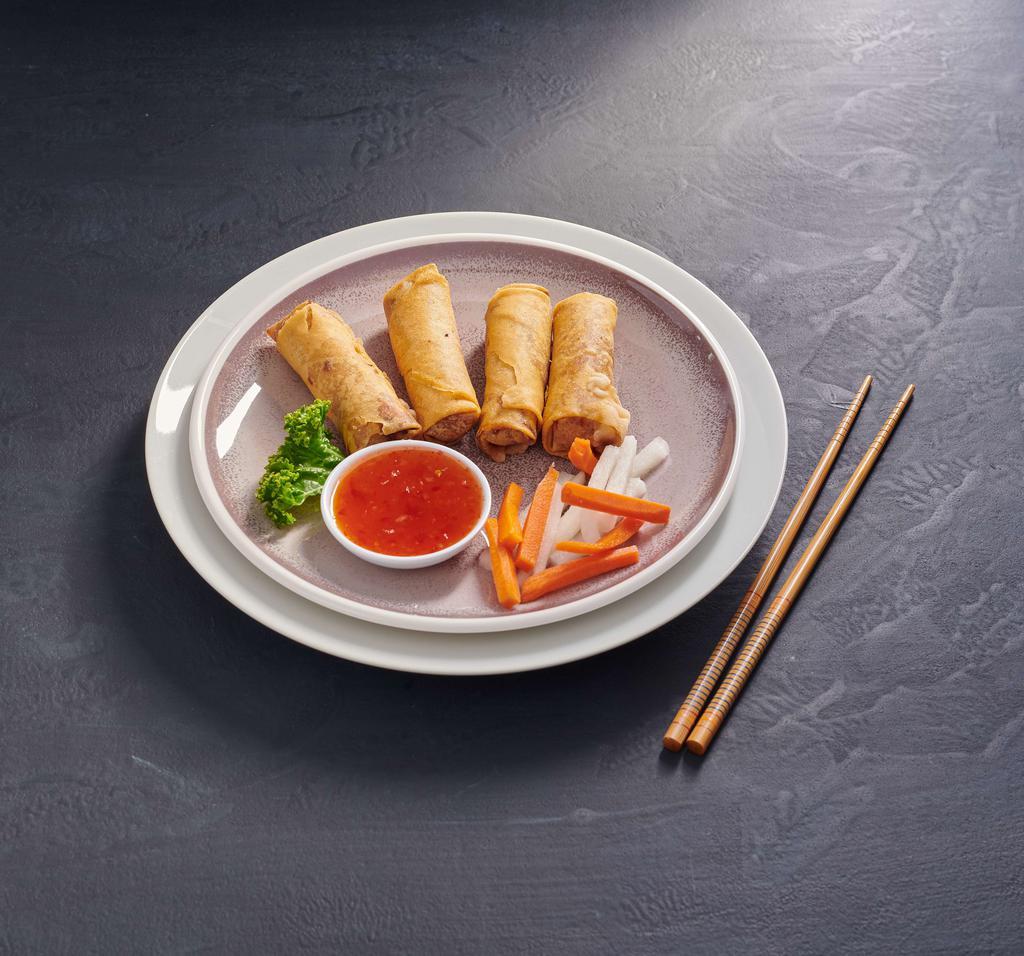 Vegetarian Crispy Roll · Crispy rolls stuffed with soft tofu, taro, cabbage, glass noodle and served with homemade vegetarian sauce.